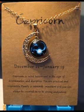 Capricorn Gold Crescent Necklace with Blue Cabochon